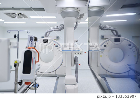 Advanced medical imaging equipment in a modern hospital room during the day 133352907