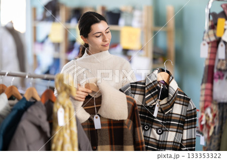 Regular customer Armenian woman chooses color and style of plaid jacket Regular customer Armenian woman chooses color and style of plaid jacket 133353322