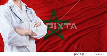Doctor with crossed arms on Morocco flag. Moroccan health and care concept. Female doctor on Morocco flag Doctor with crossed arms on Morocco flag. Moroccan health and care concept. Female doctor on Morocco flag 133353722