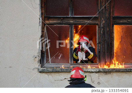 Brave firefighter rescuing a cat from a burning building, visible flames and smoke, dramatic scene, urban environment, emergency response, hero in action, saving lives Brave firefighter rescuing a cat from a burning building, visible flames and smoke, dramatic scene, urban environment, emergency response, hero in action, saving lives 133354091
