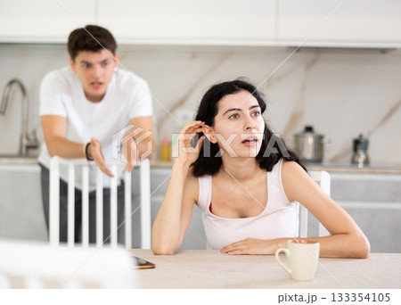 Man quarrels with his wife and shouts at her Man quarrels with his wife and shouts at her 133354105