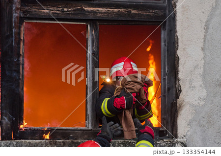 Firefighters battling flames in burning building, risking lives, firemen extinguishing blaze, emergency response, danger, rescue operation, dramatic scene, firefighters in action Firefighters battling flames in burning building, risking lives, firemen extinguishing blaze, emergency response, danger, rescue operation, dramatic scene, firefighters in action 133354144
