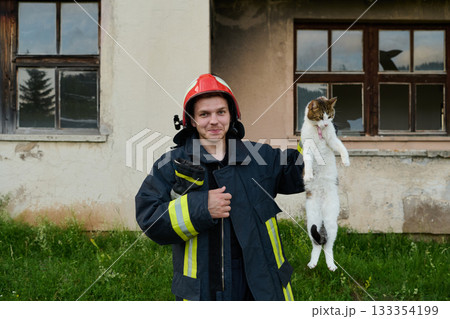 Firefighter rescues a cat from a burning building, hero holding a rescued pet, rescue operation, urban scene, firefighter in uniform, saving animal, outdoor setting Firefighter rescues a cat from a burning building, hero holding a rescued pet, rescue operation, urban scene, firefighter in uniform, saving animal, outdoor setting 133354199