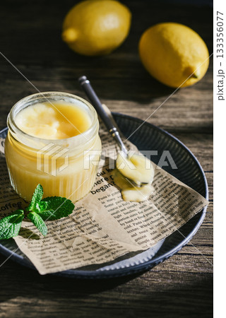 Homemade lemon curd in a glass jar Homemade lemon curd in a glass jar 133356077