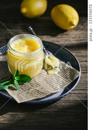 Homemade lemon curd in a glass jar Homemade lemon curd in a glass jar 133356078