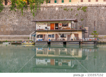 Houseboat on the Tiber River in Rome, Italy Houseboat on the Tiber River in Rome, Italy 133357132