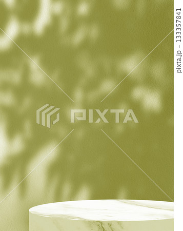 Minimalist Product Display with Leaf Shadows on a Green Wall and Marble Stand. 133357841