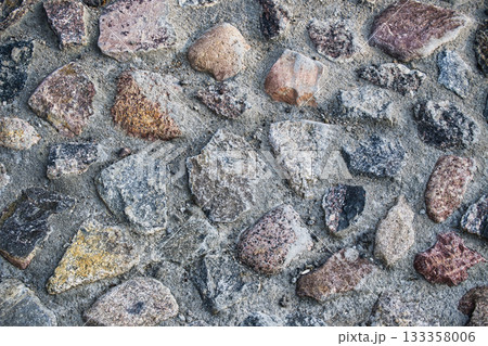 Close-Up View of Rough Stone Texture for Background or Design 133358006