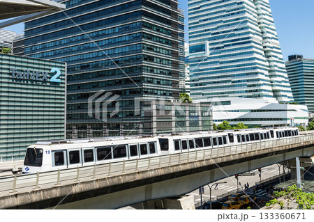 A train on the Wenhu or Brown Line of the Taipei MRT passes by the modern metropolis building in Nangang Software Park Area. 133360671