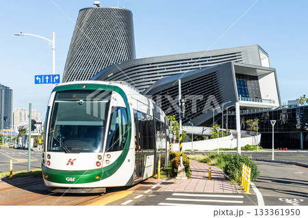 The circular light rail train drives past the Kaohsiung Port Cruise Terminal station in Taiwan. 133361950