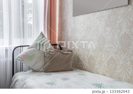 Cozy Bedroom Corner with Decorative Pillows and Soft Light Cozy Bedroom Corner with Decorative Pillows and Soft Light 133362043