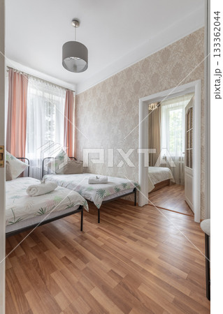 Bright Twin Bedroom Interior with View to Second Room Bright Twin Bedroom Interior with View to Second Room 133362044