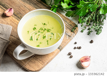 Hot delicious bouillon (bone broth) in mug 133362142