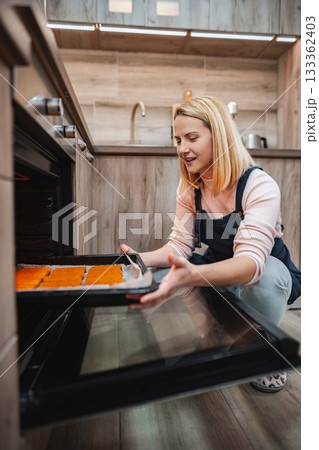 Baking colorful treats in a modern kitchen with a joyful atmosphere Baking colorful treats in a modern kitchen with a joyful atmosphere 133362403