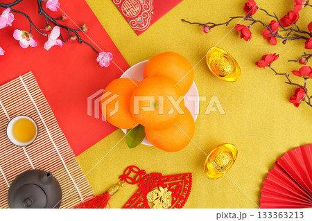 Chinese New Year fruits and decorations symbolizing good fortune and prosperity Chinese New Year fruits and decorations symbolizing good fortune and prosperity 133363213