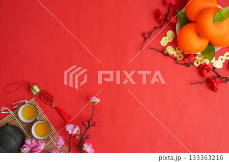 Chinese New Year festive arrangement with oranges and tea 133363216