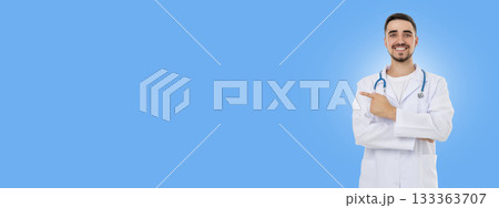 Doctor in a blue background smiles with stethoscope Doctor in a blue background smiles with stethoscope 133363707