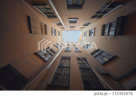 Petersburg yard well. View up to the sky, like a square window into the void. Loneliness and gloom. Geometric perspective Petersburg yard well. View up to the sky, like a square window into the void. Loneliness and gloom. Geometric perspective 133363878