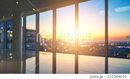 The long glass hallway of a modern office building interior is empty, showing bright light through the window and an architectural design 133364635