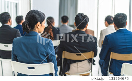 Business people group at a conference table meeting inside an airport office interior Business people group at a conference table meeting inside an airport office interior 133364676