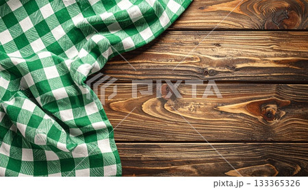 Vintage red checkered tablecloth and napkin on an old weathered brown wooden plank board texture Vintage red checkered tablecloth and napkin on an old weathered brown wooden plank board texture 133365326