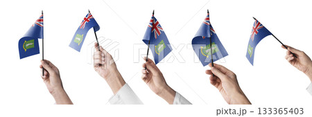 The British Virgin Islands flag in hand in different angles on a white background The British Virgin Islands flag in hand in different angles on a white background 133365403