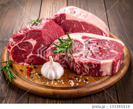 Different types of raw A5 beef on the wooden background Different types of raw A5 beef on the wooden background 133365818