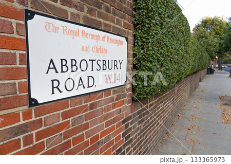Abbotsbury Road W14 street sign on brick wall, Kensington and Chelsea, London, UK 133365973