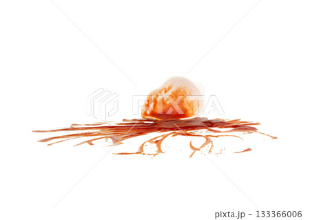 Ketchup is in a cup tomato splash isolated on white background 133366006