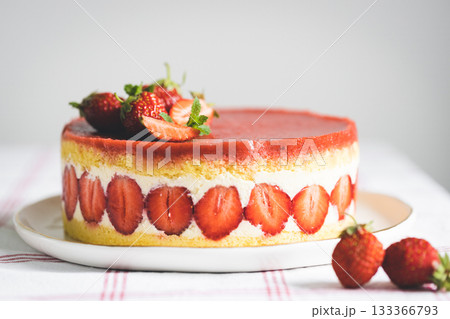 French strawberry cake Fraisier on white plate. French strawberry cake Fraisier on white plate. 133366793