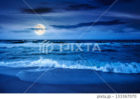 black sea waves crashing sandy beach at night. summer vacation on a windy weather under dark cloudy sky in full moon light. view of dramatic seascape. background for investment or abstract concepts black sea waves crashing sandy beach at night. summer vacation on a windy weather under dark cloudy sky in full moon light. view of dramatic seascape. background for investment or abstract concepts 133367070