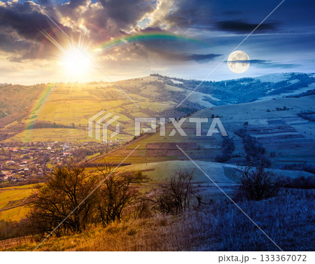 countryside mountain landscape on autumn equinox. day and night time change. alps with sun and moon. beautiful place. scenery with forest on hills. beauty in nature and rural sustainability concept countryside mountain landscape on autumn equinox. day and night time change. alps with sun and moon. beautiful place. scenery with forest on hills. beauty in nature and rural sustainability concept 133367072