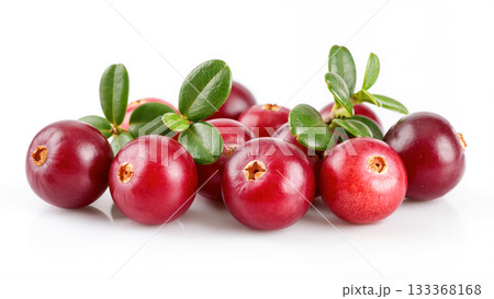 Fresh ripe cranberries with green leaves isolated on white background. Close-up of juicy red berries with smooth texture and natural shine. 133368168