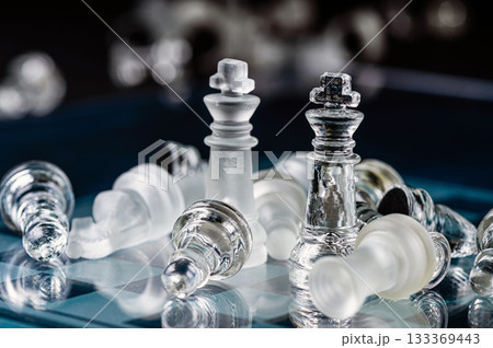 glass chess board game in black background ,selective focus on King, leadership concept glass chess board game in black background ,selective focus on King, leadership concept 133369443