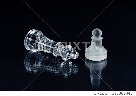 transparent glass chess on black background, selective focus on king piece, close up transparent glass chess on black background, selective focus on king piece, close up 133369446