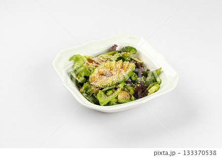 Fresh green salad with avocado and sesame 133370538