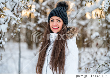 young female walking in the snowy winter day outdoor, winter forest landscape background young female walking in the snowy winter day outdoor, winter forest landscape background 133371127