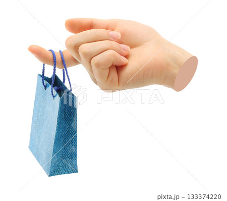 Hand holds mini shopping bag, isolated on transparent background, shopping concept. Contemporary art design Hand holds mini shopping bag, isolated on transparent background, shopping concept. Contemporary art design 133374220