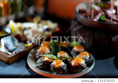 Pumpernickel bread sandwich snack with cured smoked salmon and fresh avocado served as close-up on a wooden cutting board Pumpernickel bread sandwich snack with cured smoked salmon and fresh avocado served as close-up on a wooden cutting board 133378153