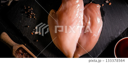 raw chicken fillet on stone background with copy space for your text 133378564