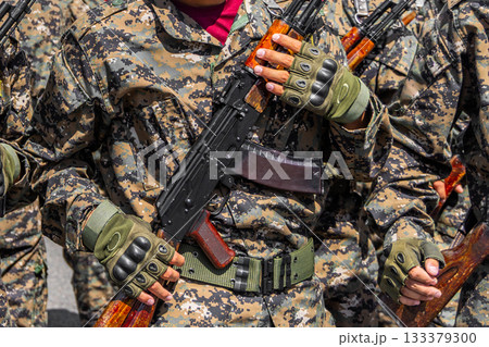 soldier holding assault rifle at sunny day 133379300