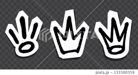 Graffiti-style black crown and symbol stickers with white outlines on dark background. Graffiti-style black crown and symbol stickers with white outlines on dark background. 133380359
