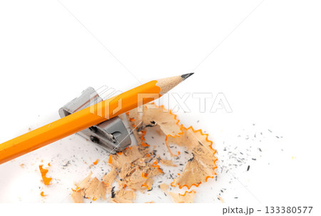 Sharpening pencils isolated. Yellow wooden graphite pencils with erasers, pencil shavings Sharpening pencils isolated. Yellow wooden graphite pencils with erasers, pencil shavings 133380577