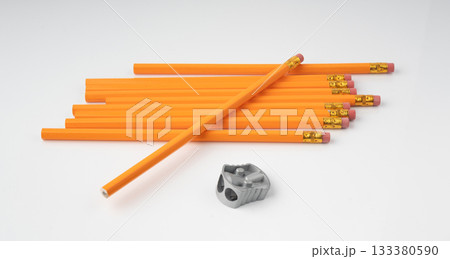 Pencils with a rubber isolated. Unsharpened yellow wooden graphite pencils Pencils with a rubber isolated. Unsharpened yellow wooden graphite pencils 133380590