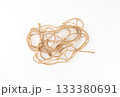 Twine rope piece isolated, jute loop fragment, beige packaging cord knots, old natural line cable 133380691