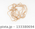 Twine rope piece isolated, jute loop fragment, beige packaging cord knots, old natural line cable 133380694