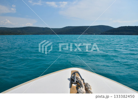 Sailing in white boat blue sea water Sailing in white boat blue sea water 133382450
