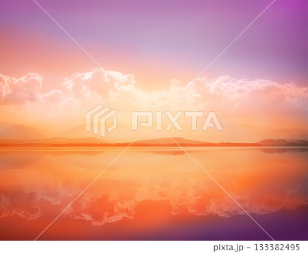 Sunset waterscape of lake with sky reflection Sunset waterscape of lake with sky reflection 133382495