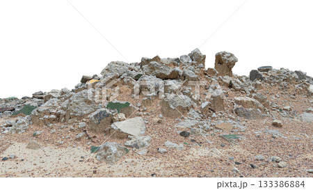 Broken pieces of cement and rocks on a pile of dirt. Isolated white background. 133386884