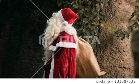 Santa Claus looking for next house to reach Santa Claus looking for next house to reach 133387538